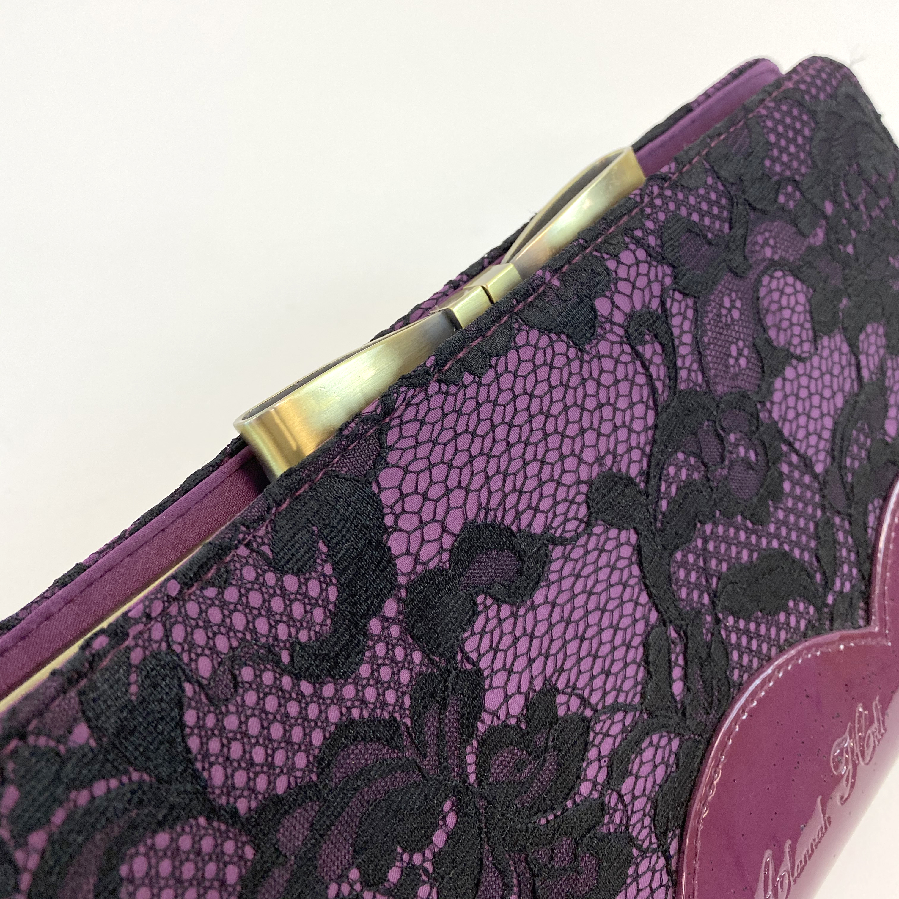 Alannah Hill Leather and Lace-effect Clutch
